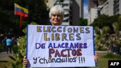 Una manifestante en apoyo a María Corina Machado, en la plaza Altamira de Caracas el 23 de enero de 2024. (Gabriela Oraa/AFP).