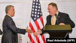 El presidente de Colombia, Iván Duque (izq) y el secretario de Estado, Mike Pompeo (der). (Raul Arboleda/AFP)