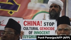 Musulmanes en la India denuncian la represión a los uigures en China. (Punit Paranjpe / AFP). 